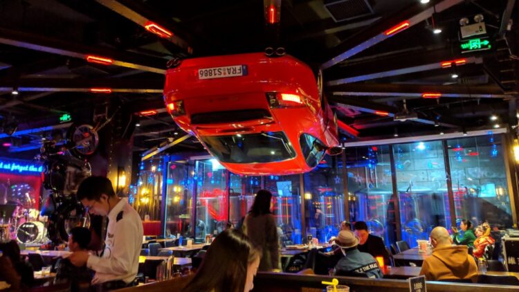 Dining under a Ferrari is possible at this restaurant in China—a Shanghai restaurant has turned a Ferrari F430 into a mechanical clock that dominates the entire premises