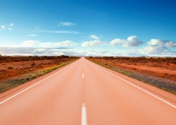 Goodbye to Iowa's gray highways—the northwest corner of the state surprises with roads that turn pink due to the outcropping of Sioux quartzite