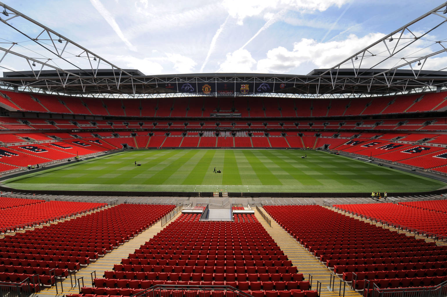 LONDON, UNITED KINGDOM - MAY 24:  In this handout image provided by UEFA, final preparations are made to the pitch at Wembley Stadium for the Champions League Final, May 24, 2011  in London, England. The UEFA Champions League final between FC Barcelona and Manchester United FC will be held at Wembley stadium on May 28.  (Photo by UEFA via Getty Images)