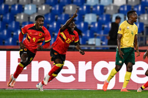 Angola's midfielder #23 Show (2nd L) celebrates scoring his team's first goal during the Africa Cup of Nations (CAN) Group B football match between South Africa and Angola at Marrakesh Stadium in Marrakesh, Morocco on December 22, 2025. (Photo by Khaled DESOUKI / AFP via Getty Images)