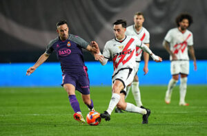 MADRID, SPAIN - APRIL 04: Pedro Diaz of Rayo Vallecano is challenged by Edu Exposito of RCD Espanyol during the LaLiga match between Rayo Vallecano and RCD Espanyol de Barcelona at Estadio de Vallecas on April 04, 2025 in Madrid, Spain. (Photo by Angel Martinez/Getty Images)