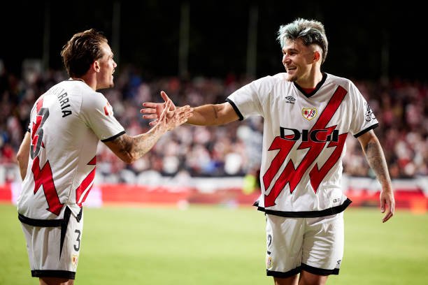 MADRID, SPAIN - SEPTEMBER 16: Andrei Rațiu of Rayo Vallecano celebrates after scoring their side's second goal with his teammate Pep Chavarria of Rayo Vallecano during the LaLiga match between Rayo Vallecano and CA Osasuna at Estadio de Vallecas on September 16, 2024 in Madrid, Spain. (Photo by Alvaro Medranda/Quality Sport Images/Getty Images)
